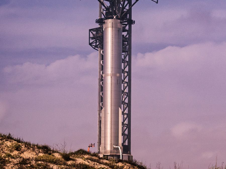 Archive: SpaceX Super Heavy booster B7 on the orbital launch mount at Starbase, Boca Chica, Texas, beside the launch tower, 24 Feb 2023 (Mobilus In Mobili, CC BY-SA 2.0). Not Starship Flight 14, not the FAA 18 September 2026 airspace window, not Booster 21 / Ship 41, and not a 2026 countdown still.