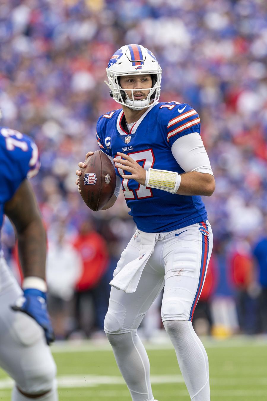 Archive: Josh Allen (#17) in the pocket with the ball, Bills blue home kit at Highmark Stadium vs Washington, 26 Sep 2021 (All-Pro Reels / Flickr via Commons, CC BY-SA 2.0). Not the 17 September 2026 TNF opener vs Detroit, not a five-TD celebrate still, and not a day-of Highmark Lions still.