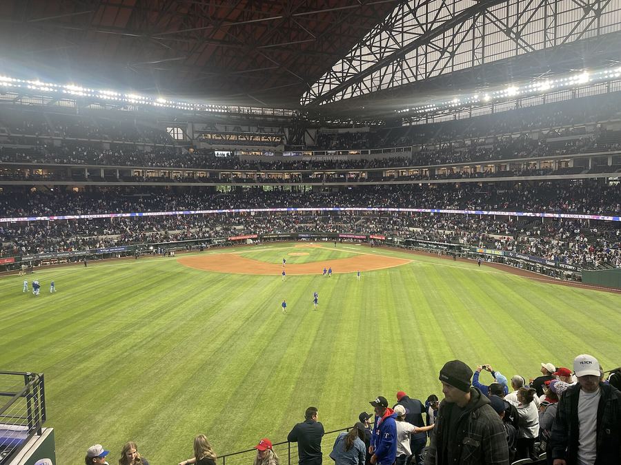 Archive: Globe Life Field interior from center field with LED “RANGERS WIN!”, 6 Apr 2025 (BullDawg2021 / Wikimedia Commons, CC BY 4.0). Not the 19 September 2026 Rangers–TOR sole AL West at Globe Life Field, not a day-of Blue Jays series celebrate still, and not a Rangers 6–2 TOR still.