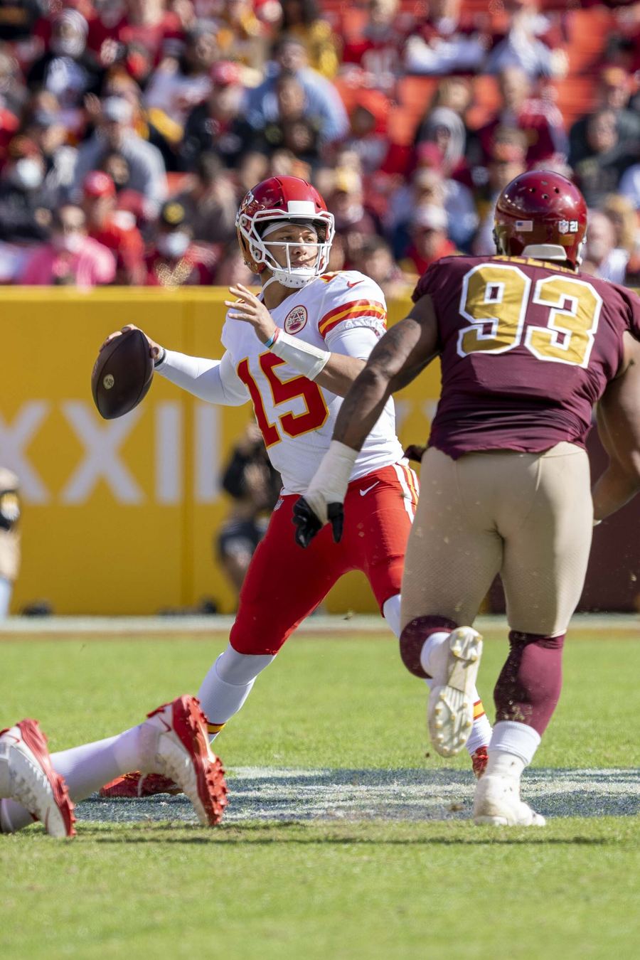 Archive: Patrick Mahomes #15 cocked to throw, Chiefs white away vs Washington, 2021 (All-Pro Reels / Flickr via Commons, CC BY-SA 2.0). Not the 20 September 2026 Chiefs–Colts OT, not Harrison Butker’s 40-yard Arrowhead kick, and not a day-of Arrowhead still.