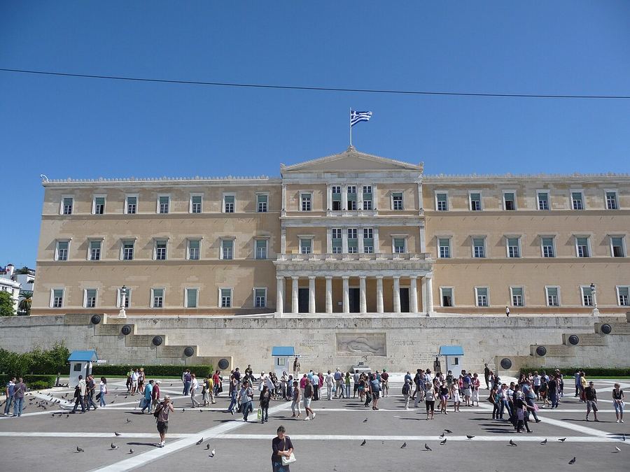 Archive: Hellenic Parliament facing Syntagma Square, Athens — giggel (CC BY 3.0). Not the September 2026 Special Marching Order notice day, not soldiers or call-up imagery, and not day-of conscripts.