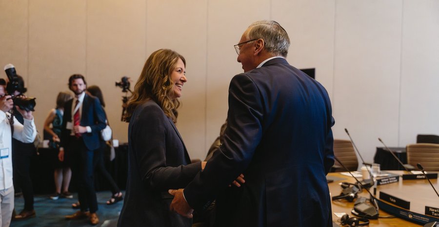 Alberta Premier Danielle Smith talks with Newfoundland and Labrador Premier Tony Wakeham at the summer meeting of Canada's premiers in Charlottetown, Prince Edward Island, in July 2026.